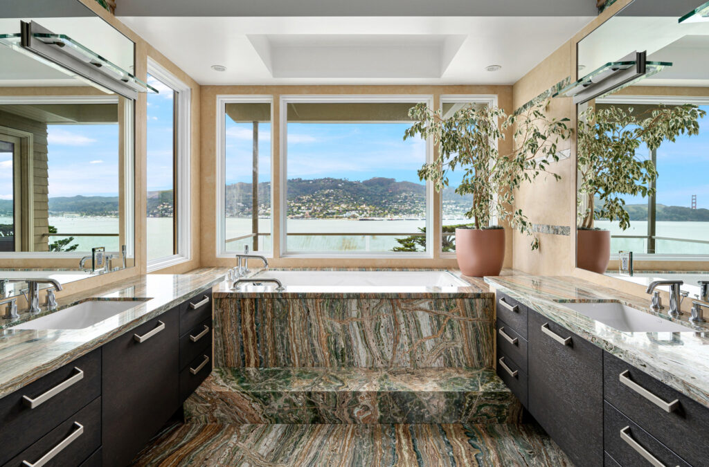 Primary bathroom with an elaborate bath overlooking the Bay